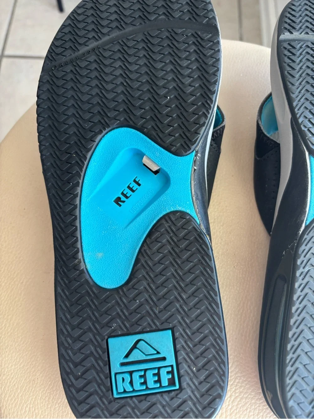 Reef Men's Gray Footbed Flip-Flops with Black Straps and Blue Lining